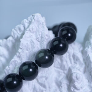 iridescent-obsidian-round-bead-bracelet-dark-green-close-up