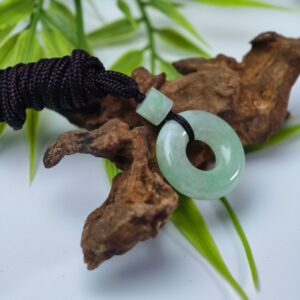 natural-jadeite-ping-an-huan-pendant-light-green-side